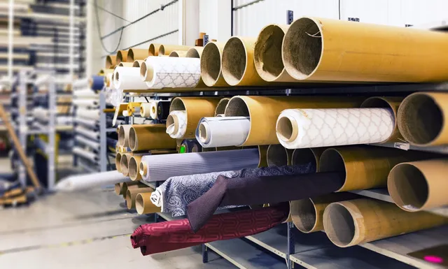 Textile rolls arranged in a factory